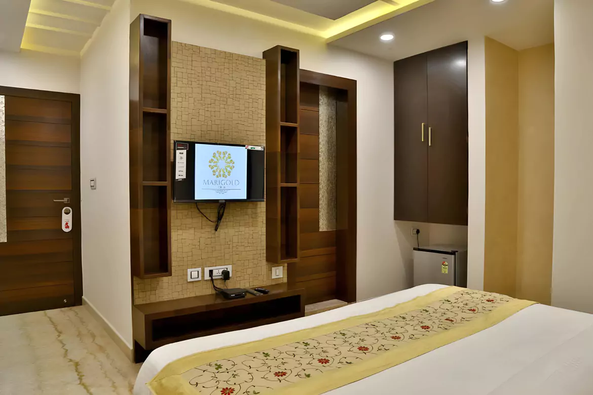 Spacious deluxe room interior at Marigold Inn Homestay Jaipur