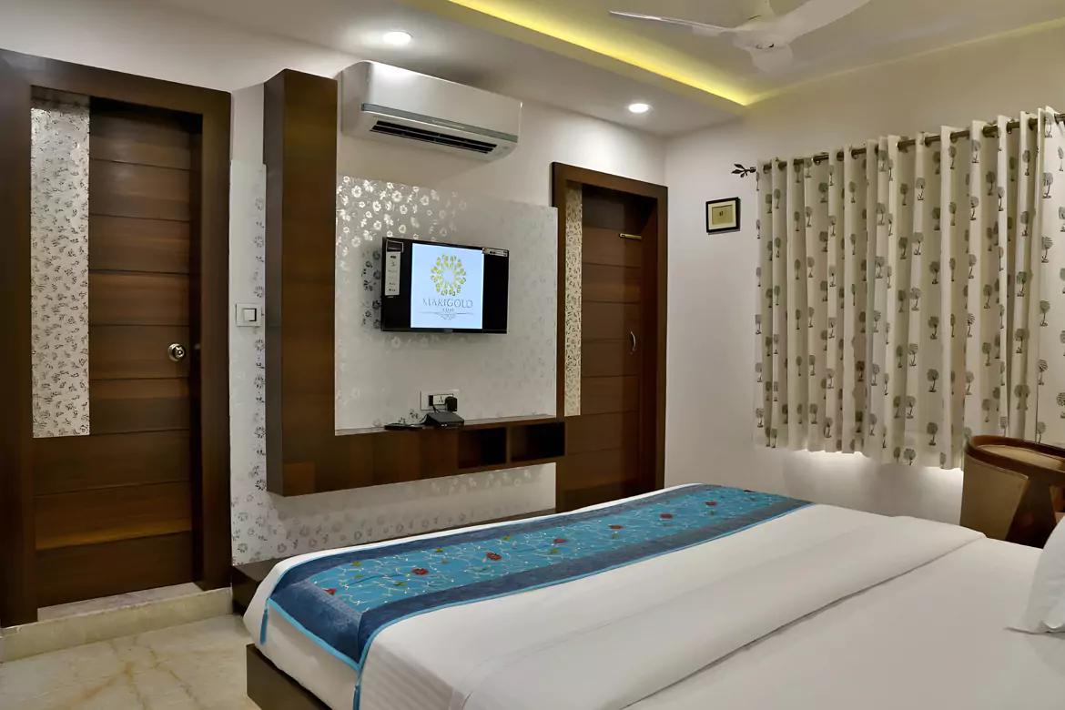 Elegant deluxe bedroom at Marigold Inn Homestay Jaipur